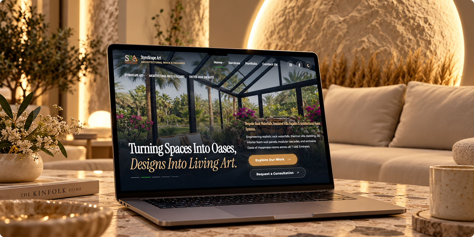 The StyroScape Art website on a laptop in a warm, stone-lit living room